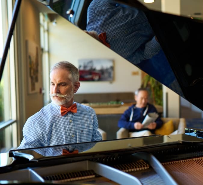Senior man playing on piano