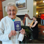 Woman holding passport at Passport to Fun event