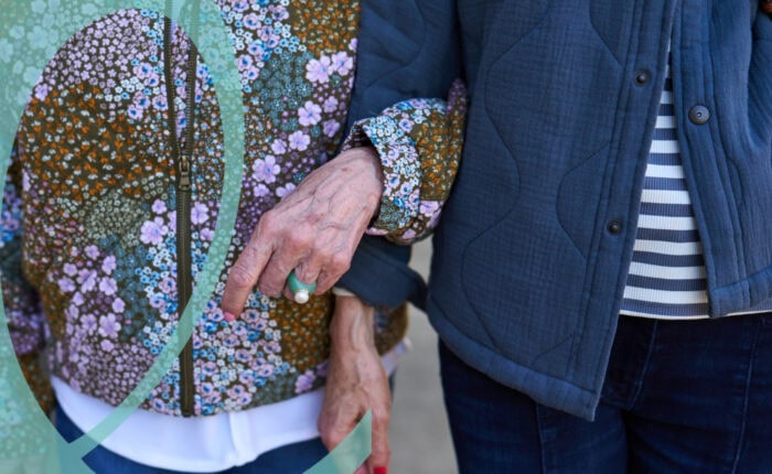 Women walking hand in hand