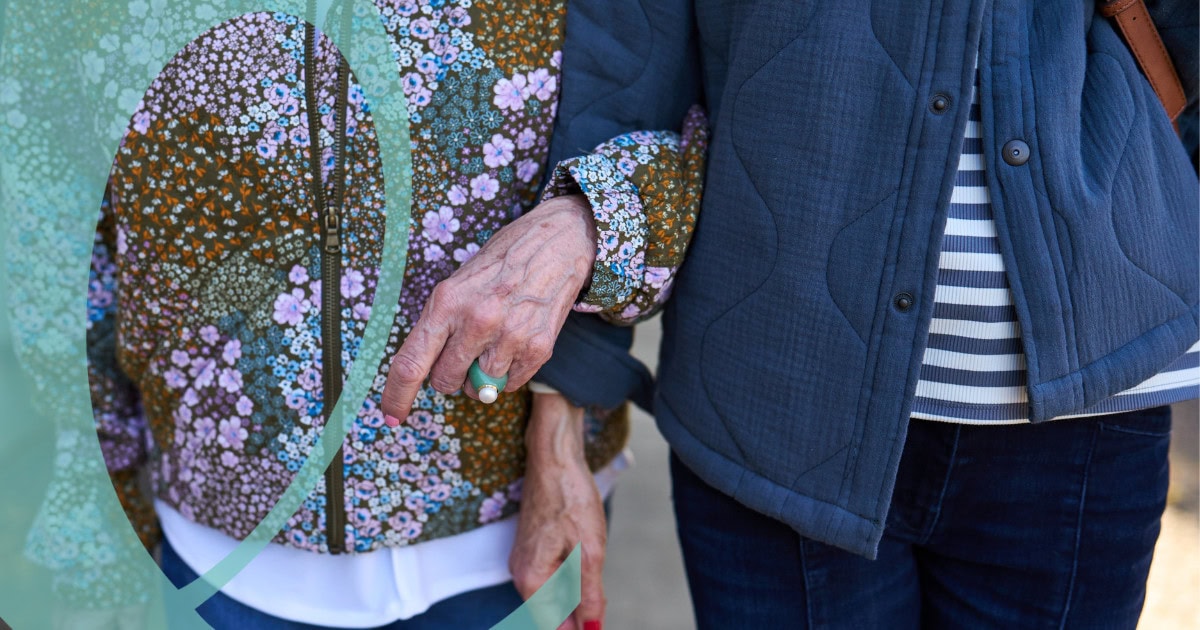 Women walking hand in hand