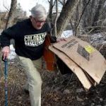 Resident John Canova Picking up Trash at Boulder Creek