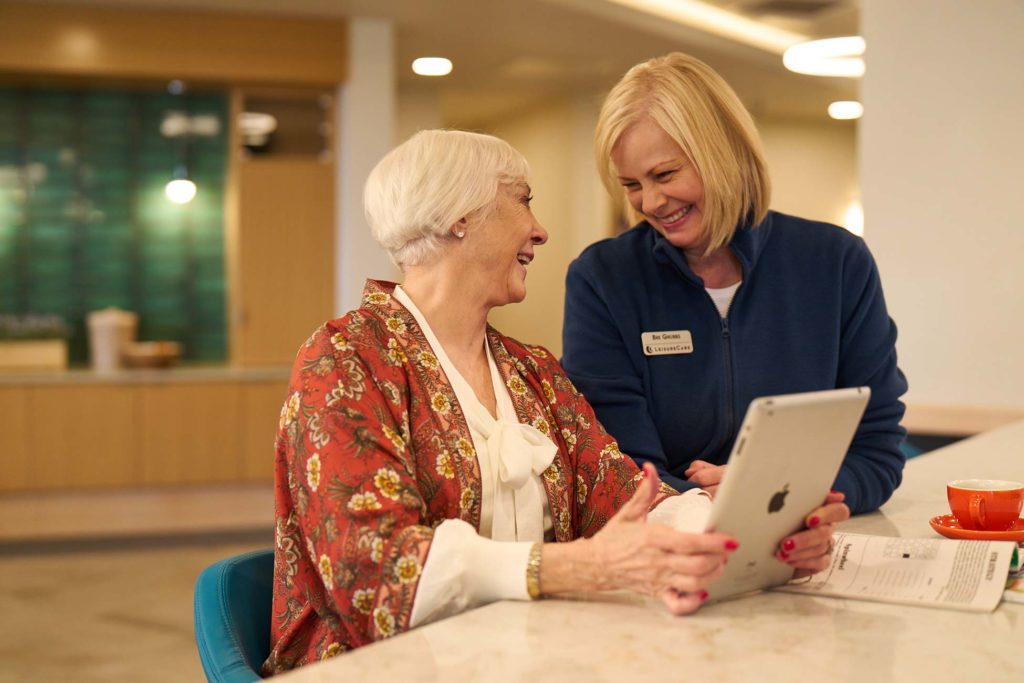 Staff helping resident