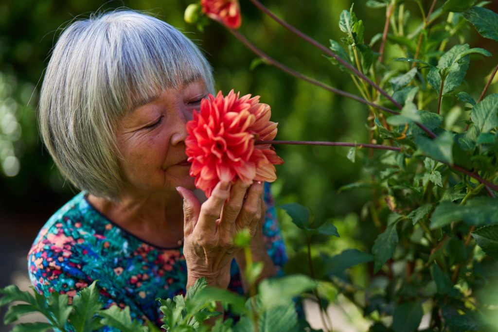 Woman smelling flower