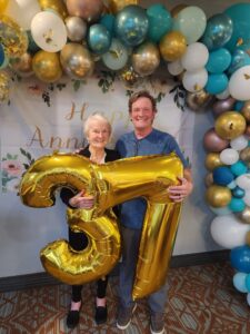 Resident and son at anniversary party