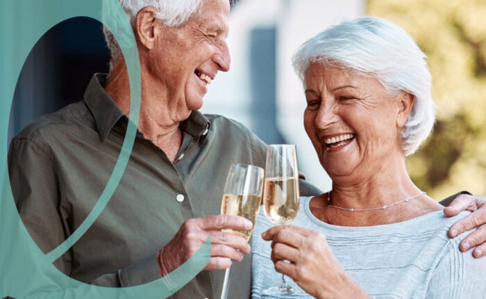 Older couple toasting champagne