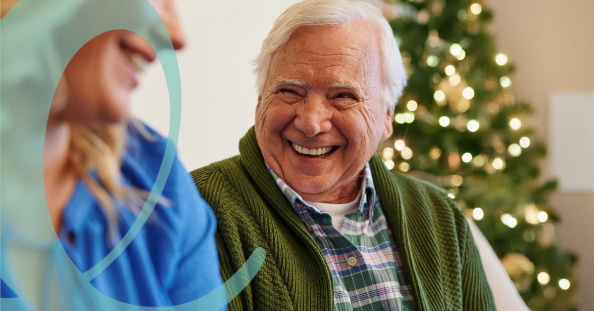Man smiling at caregiver during holidays