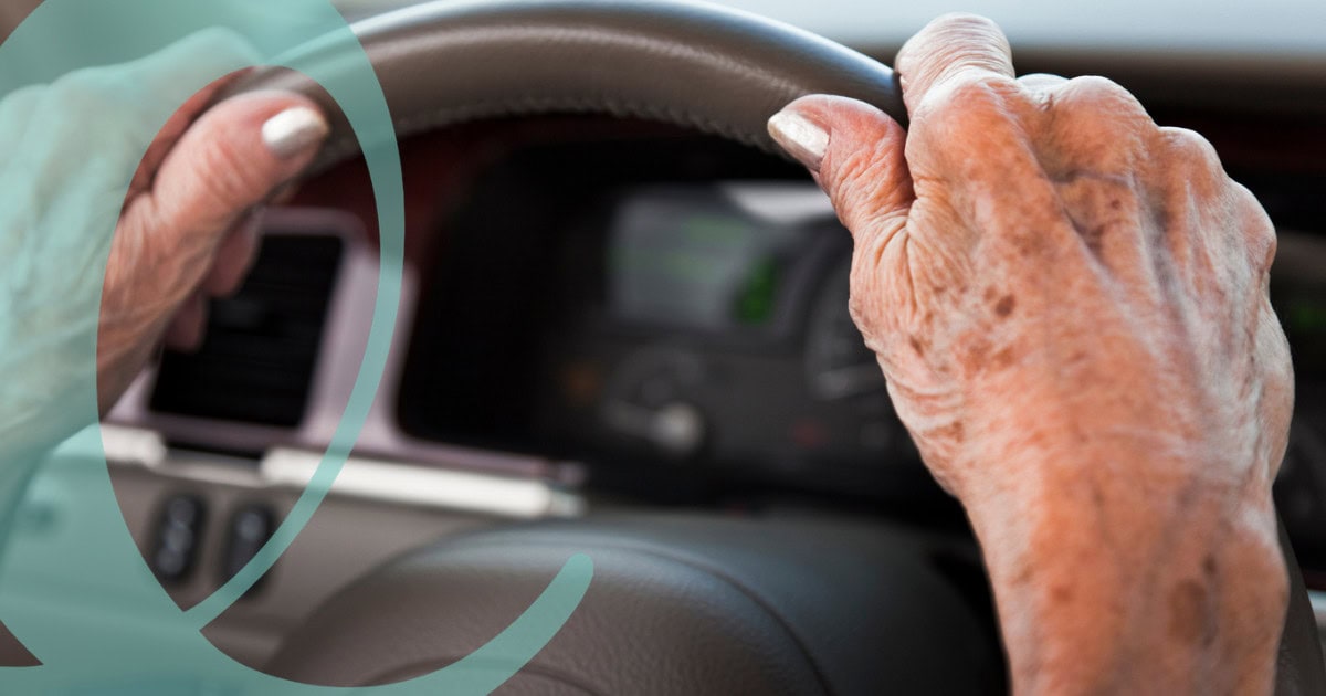 Senior driving hands on wheel